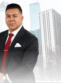 Tony Garcia, REALTOR® with Keller Williams ONEChicago, in a dark pinstripe suit against a Chicago skyline backdrop